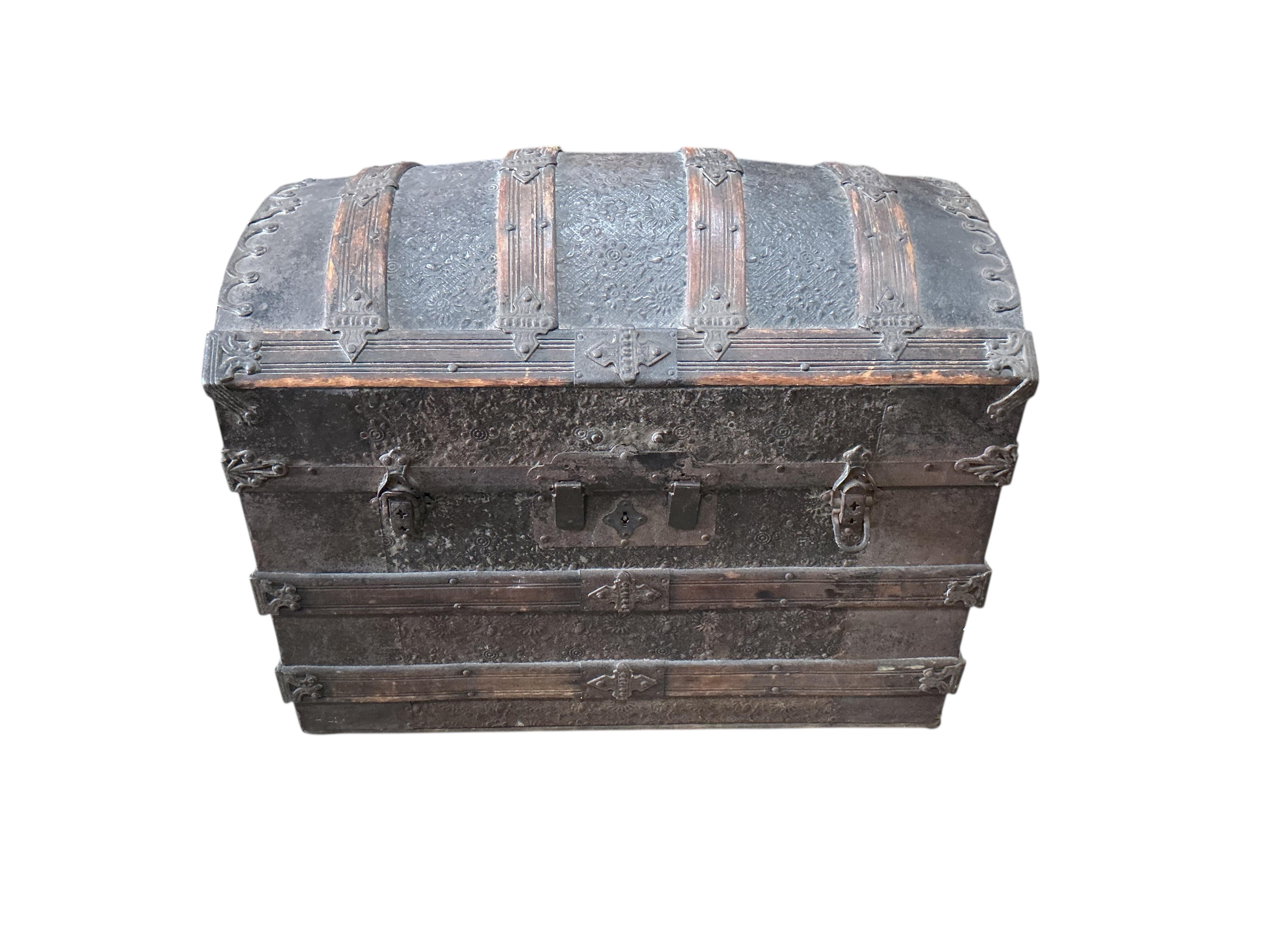 A Victorian metal mounted wood bound domed trunk, width 75cm, depth 46cm, height 54cm